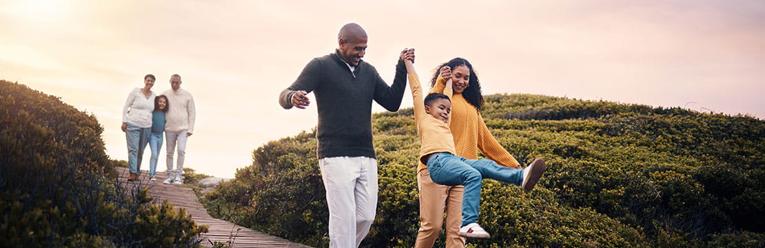 Children and grandparents spending time together in nature. 